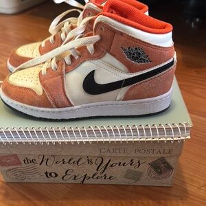 Nike Woman’s Orange and Cream High-Top Sneakers